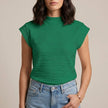 Green FJØRNA summer women's top with high neck and cap sleeves, stylish and lightweight for warm weather.