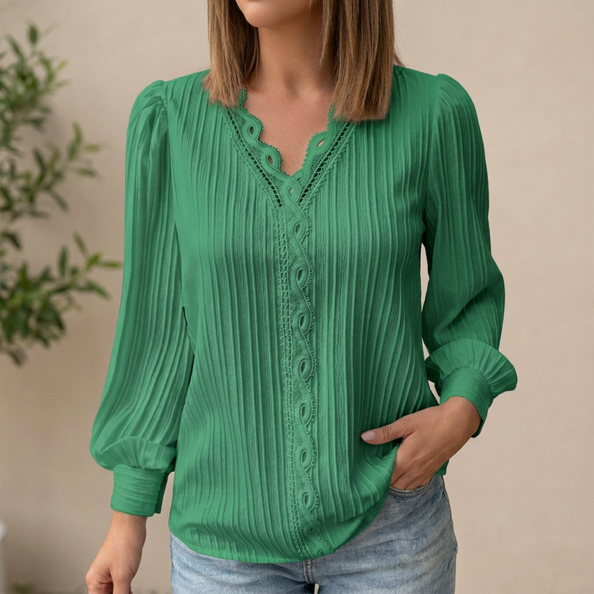 Green women's pullover blouse with V-neck, lace trim, and pintuck texture, by FJØRNA.