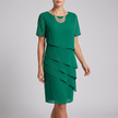 Green FJØRNA flowing tiered mini dress with ruffled sheer sleeves, lightweight and elegant for casual or semi-formal occasions.