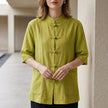 Green FJØRNA summer blouse for women with denim pockets, casual sleeveless top, perfect for warm weather.