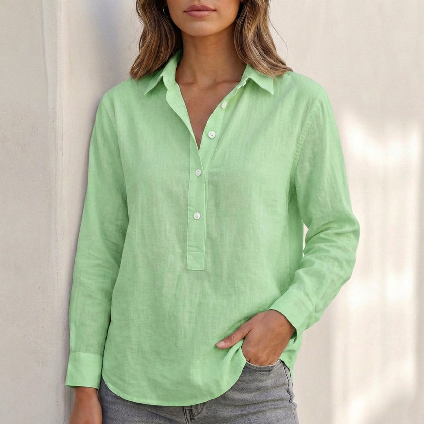 Green FJØRNA women's V-neck popover shirt with cuffed sleeves and relaxed fit, showing the soft fabric and stylish design.