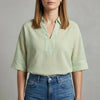Green striped linen summer blouse for women by FJØRNA, lightweight top with a relaxed fit and casual style.