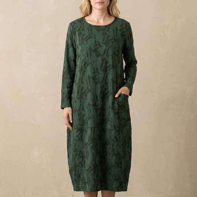 Green FJØRNA elegant maxi dress for women with long sleeves and pockets, showcasing a flowing silhouette and stylish design.