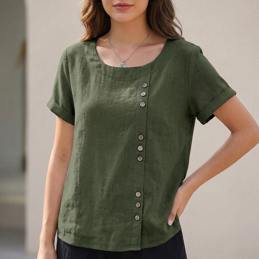 Green linen blouse for women by FJØRNA featuring an asymmetric design, perfect for relaxed daywear.