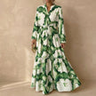 Green FJØRNA A-Line maxi dress with V-neck and puff sleeves, flowing silhouette and elegant style.