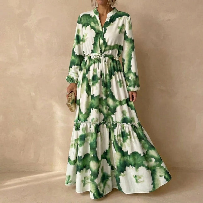 Green FJØRNA A-Line maxi dress with V-neck and puff sleeves, flowing silhouette and elegant style.