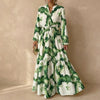 Green FJØRNA A-Line maxi dress with V-neck and puff sleeves, flowing silhouette and elegant style.