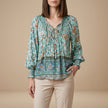 Green floral long sleeve linen summer blouse for women by FJØRNA, stylish and breathable top perfect for warm weather.