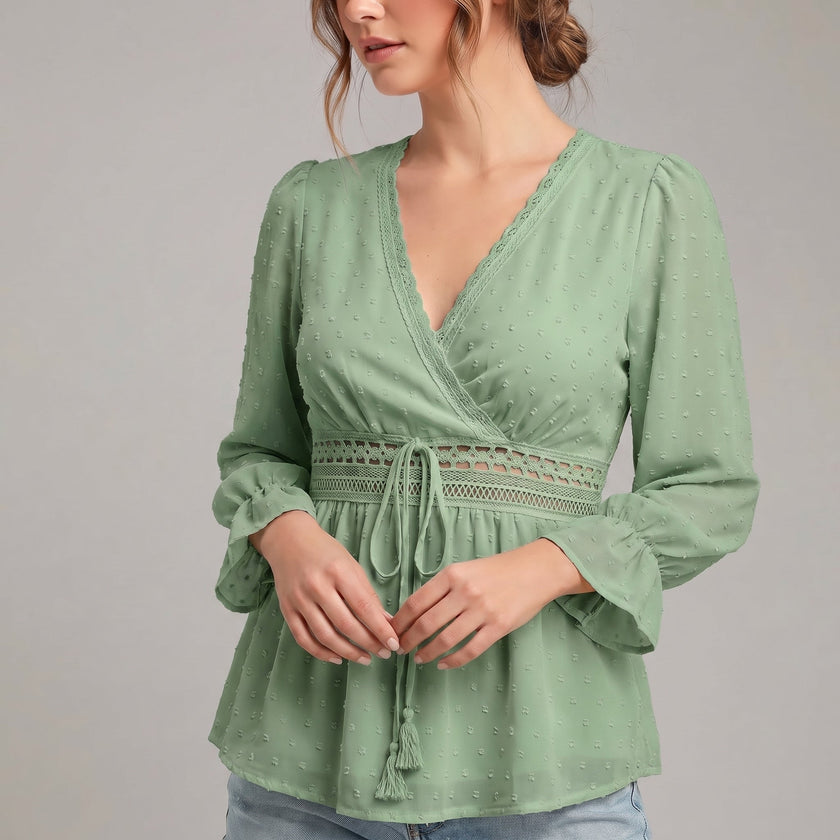Green FJØRNA summer blouse for women with v-neck and ruffle details, made of linen fabric, stylish and breathable top.