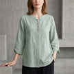 Green denim tassel summer blouse for women by FJØRNA, stylish top with tassel details and comfortable fit.