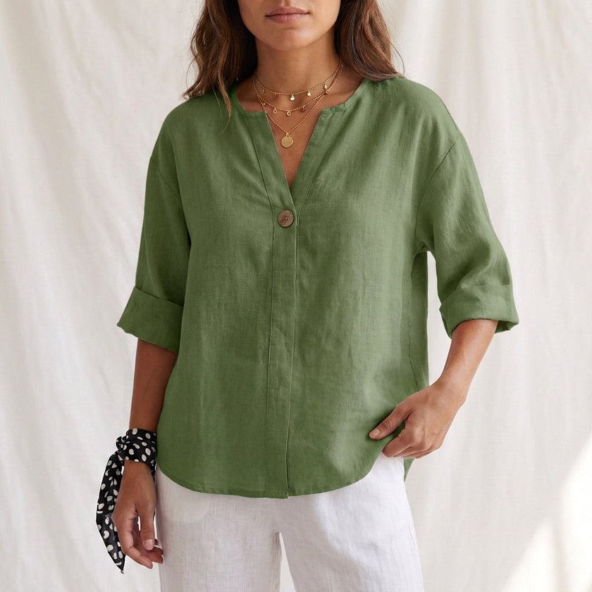 Green women's summer blouse by FJØRNA featuring a V-neck, linen fabric, and button front, perfect for warm-weather styling.