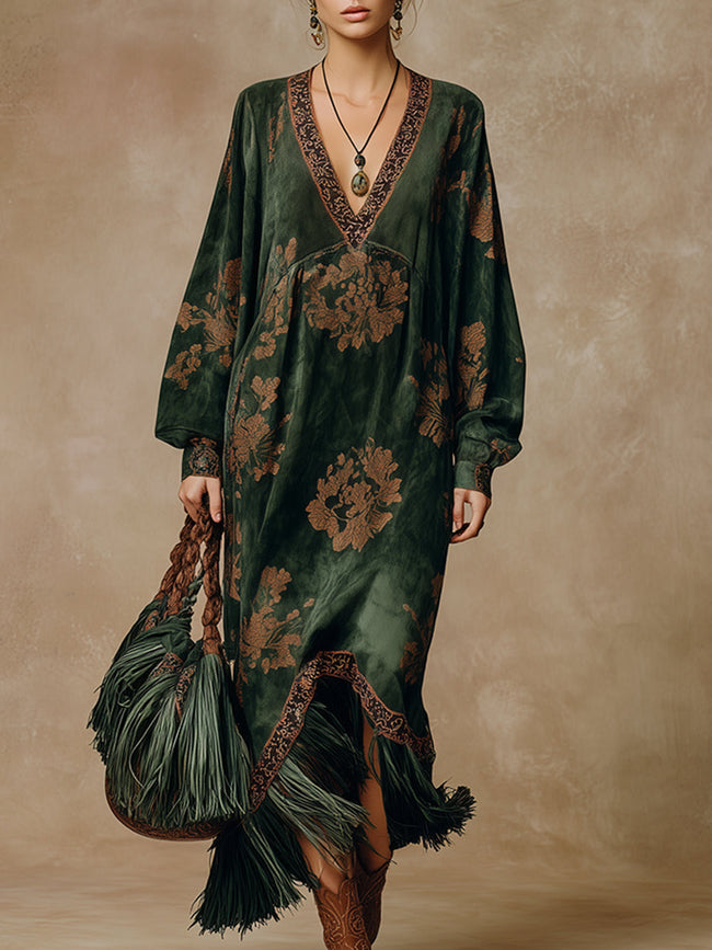 Green faux suede tassel maxi dress for women by FJØRNA, featuring a flowing silhouette and decorative tassels.