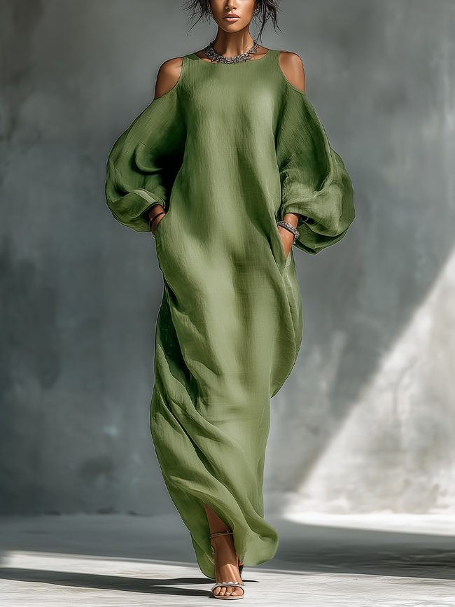 Green maxi dress for women by FJØRNA, flowing fabric, sleeveless design, and elegant style perfect for summer or formal occasions.