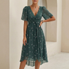 Green Sofia Amoretti flowy chiffon wrap midi dress with tie waist by FJØRNA, featuring a graceful, flowing silhouette.