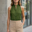 Green sleeveless denim summer blouse for women by FJØRNA, featuring a casual, stylish sleeveless top in denim fabric.