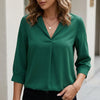 Green summer blouse for women by FJØRNA featuring a V-neck, puff sleeves, and high waist design.