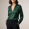 Green FJØRNA summer blouse for women with V-neck, long sleeves, satin fabric, and high waist style.