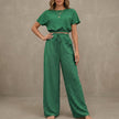 FJØRNA Coastal Breeze green textured two-piece lounge set with wide-leg pants, comfortable and stylish for relaxing at home.