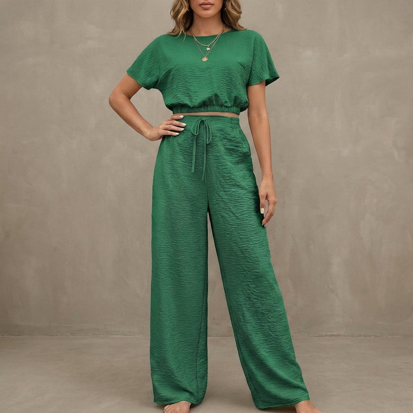 FJØRNA Coastal Breeze green textured two-piece lounge set with wide-leg pants, comfortable and stylish for relaxing at home.