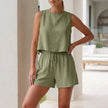 FJØRNA relaxed textured pleated two-piece set with button-front tank and matching shorts in green fabric.