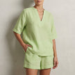 Green summer two-piece women's co-ord set with pockets, V-neck top and matching pants by FJØRNA.