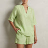 Green summer two-piece women's co-ord set with pockets, V-neck top and matching pants by FJØRNA.