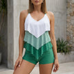Green women's summer swimsuit with V-neck and ruffle details from FJØRNA, perfect for beach or poolside wear.