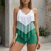 Green women's summer swimsuit with V-neck and ruffle details from FJØRNA, perfect for beach or poolside wear.
