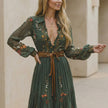 Green embroidered belted A-line maxi dress for women by FJØRNA, features a collared neckline and detailed embroidery.