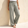 Grey linen summer trousers for women with button front detail, stylish and breathable FJØRNA women’s clothing.