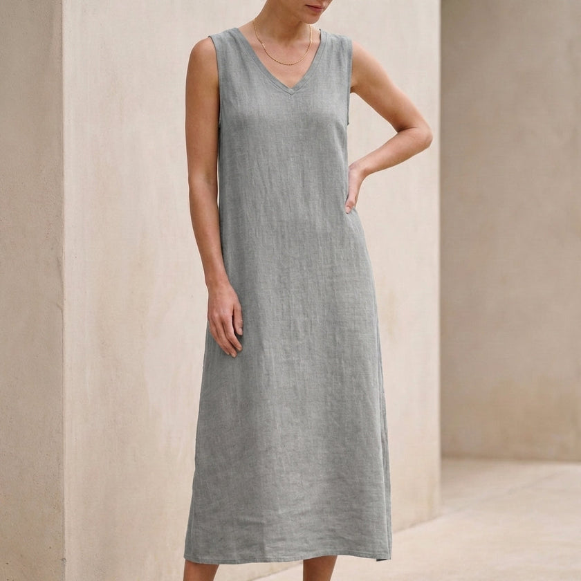 Grey FJØRNA elegant midi dress for women with a V-neck and sleeveless design, perfect for sophisticated occasions.