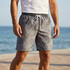 Men's knee-length shorts by FJØRNA with relaxed fit and gradient botanical print, featuring a comfortable, stylish design.