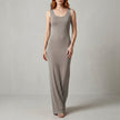 Grey Valentina Rossi sleeveless scoop neck maxi dress by FJØRNA with a body-skimming silhouette, perfect for elegant summer occasions.