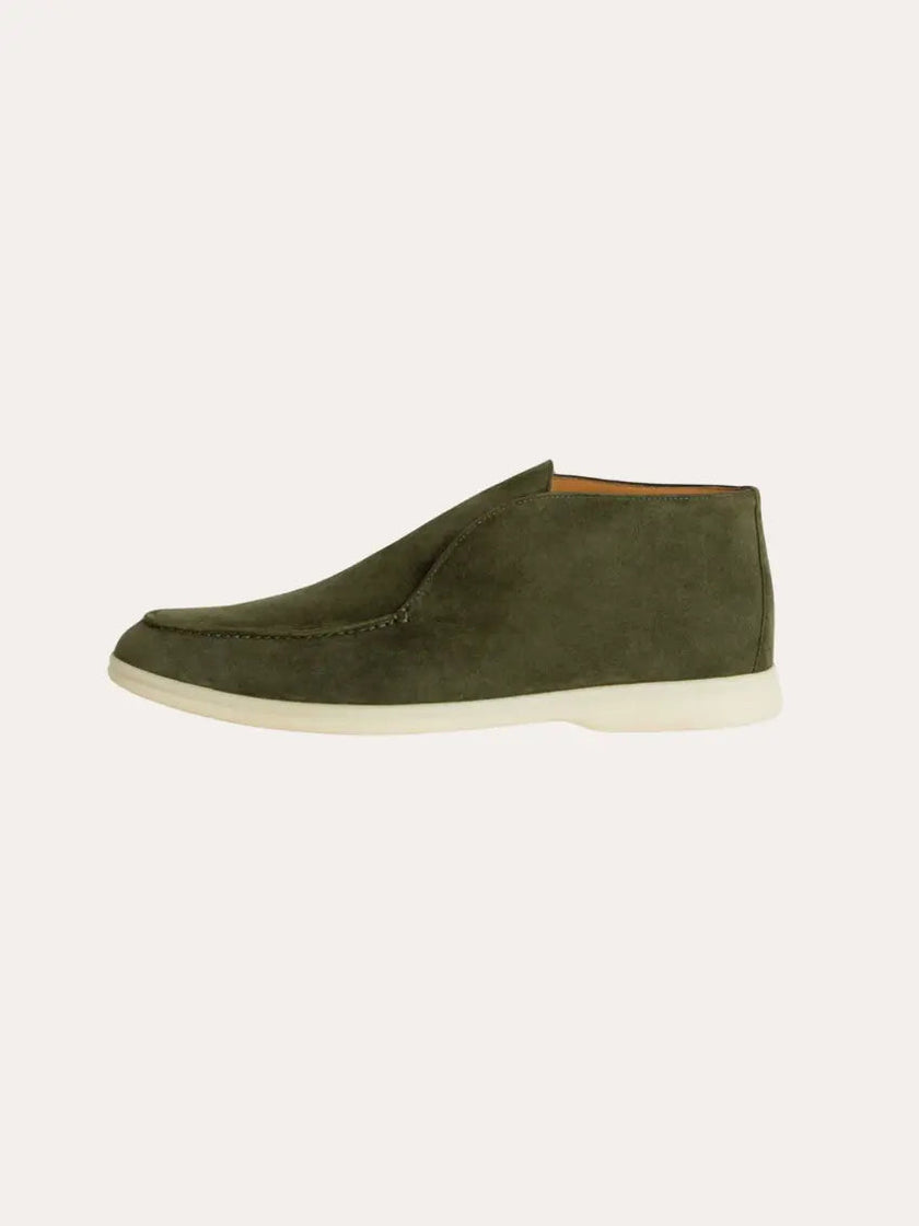 Men's classic suede loafers in deep green by FJØRNA, showcasing the stylish design and soft suede material.