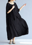 Gray linen cotton maxi dress by FJØRNA featuring a casual wedding dress style, with a flowing silhouette and relaxed fit.