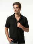 FJØRNA men's classic short sleeve button-up shirt, casual men's tops in light fabric, shown in a close-up shot.