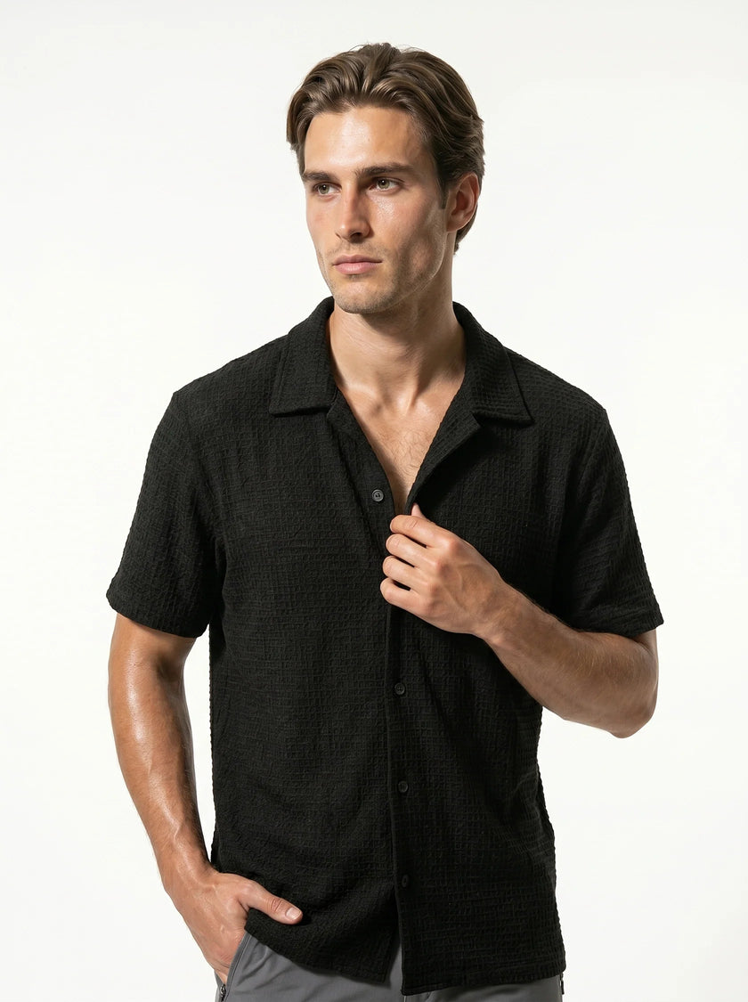 FJØRNA men's classic short sleeve button-up shirt, casual men's tops in light fabric, shown in a close-up shot.