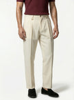 FJØRNA men's straight fit tailored trousers in classic style, shown close-up detail of the beige pants fabric and stitching.