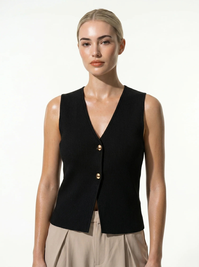 FJØRNA women's sleeveless structured waistcoat with tailored fit, layering style, and clean design, showcased in a close-up shot.