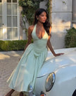 FJØRNA women's halter neck corset midi dress with fitted bodice and flowing skirt, perfect for day to night occasions.