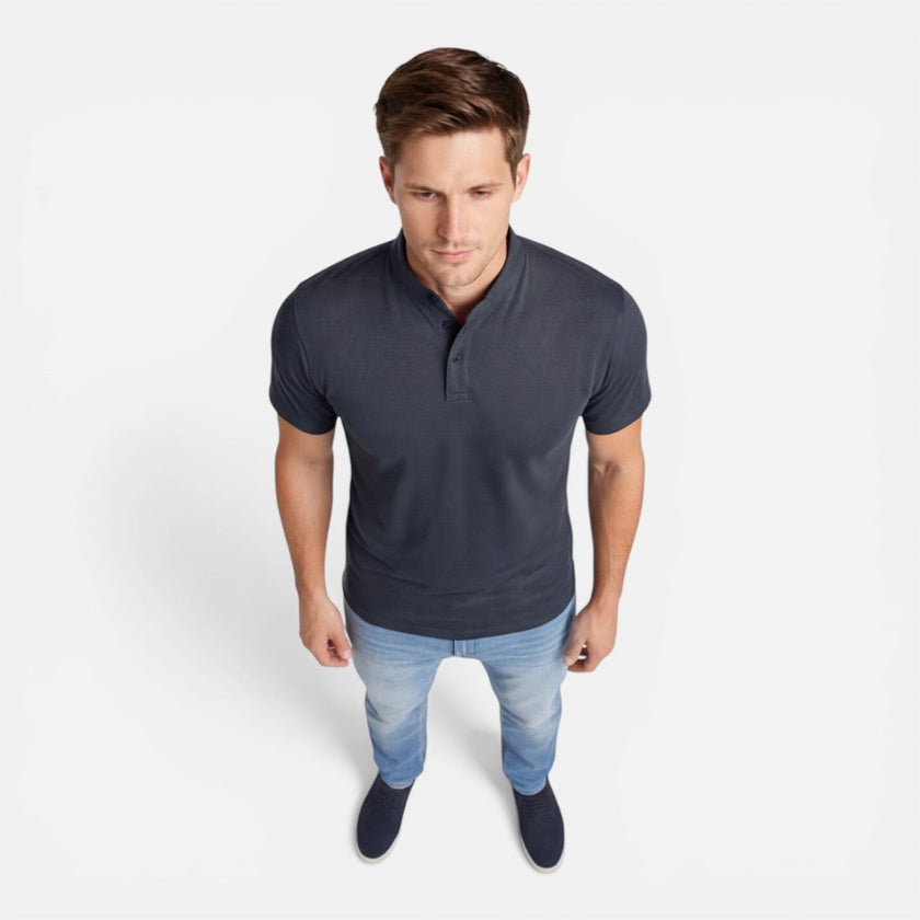 Men's short sleeve Henley shirt by FJØRNA, soft cotton fabric, slim fit casual style, shown in a natural relaxed pose.