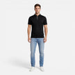 Men's short sleeve Henley shirt by FJØRNA, soft cotton, slim fit, casual men's shirt with buttoned neckline, shown on a model.