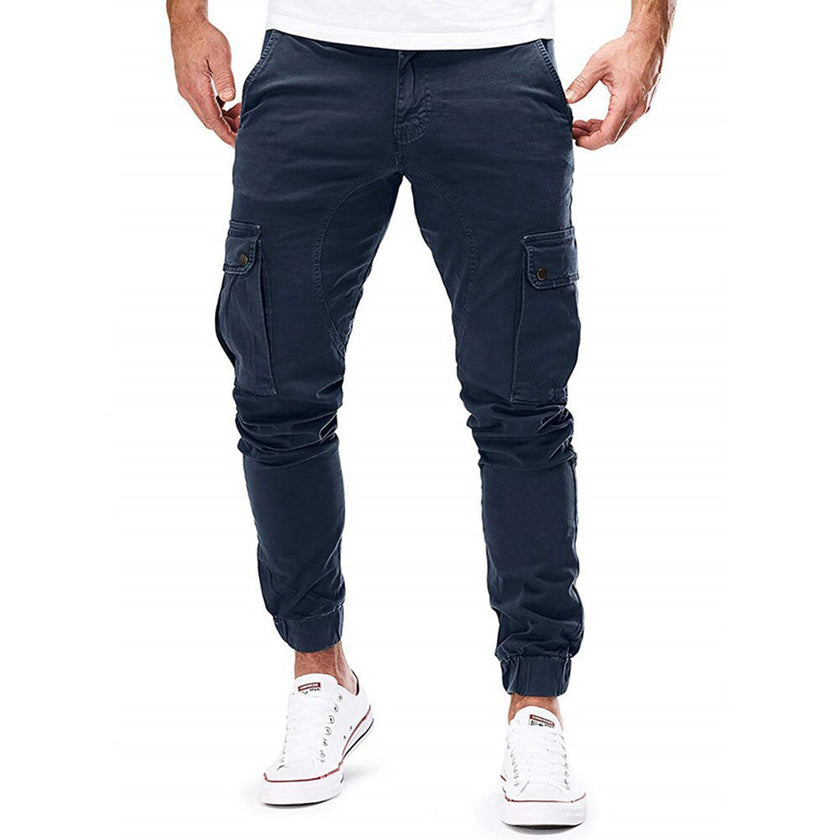 FJØRNA men's cargo pants with functional pockets and ample storage, featuring a relaxed fit and durable fabric.