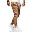 Men's cargo pants by FJØRNA with functional pockets and ample storage, shown in a casual fit on a model.
