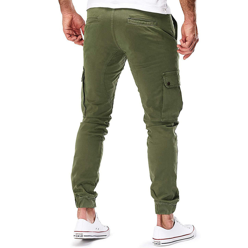 Men's FJØRNA cargo pants with functional pockets and ample storage, designed for durability and practical outdoor wear.