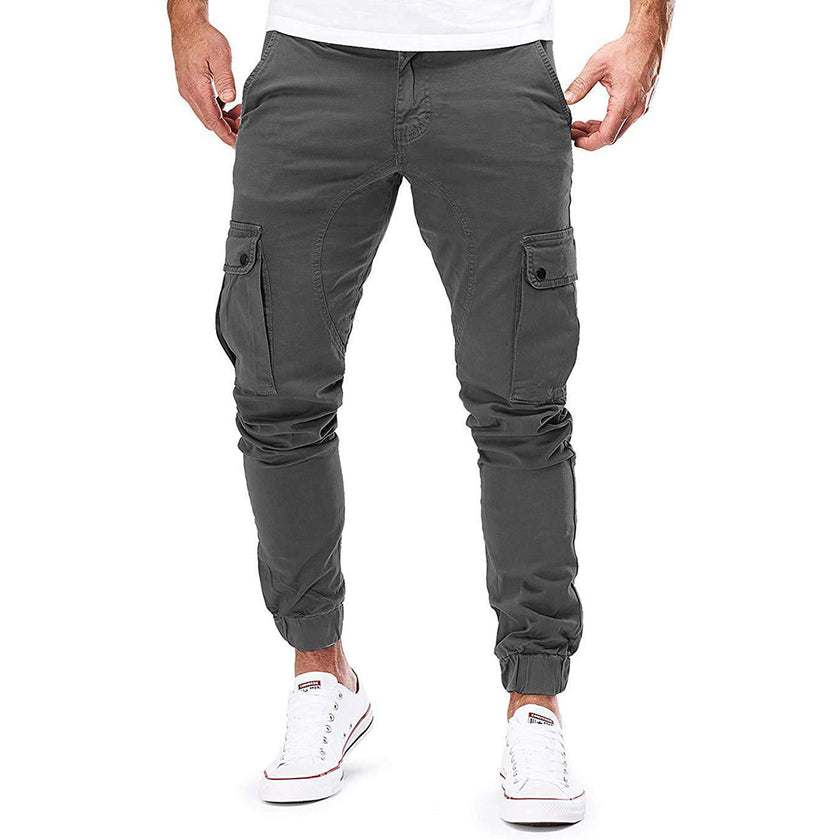Men's cargo pants by FJØRNA with functional pockets and ample storage, shown in a relaxed fit with multiple utility pockets.