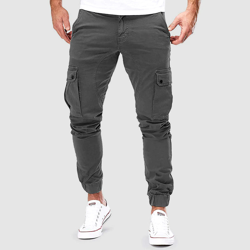 Men's cotton slim fit cargo pants with multiple pockets, stylish and comfortable FJØRNA men's pants on a model.