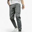 Men's FJØRNA cargo pants with stretch fabric and multiple functional pockets, designed for comfort and durability.