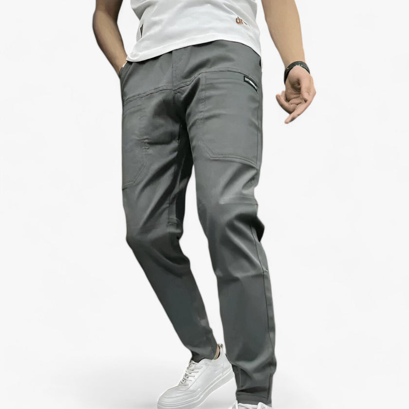 Men's FJØRNA cargo pants with stretch fabric and multiple functional pockets, designed for comfort and durability.