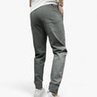 Men's FJØRNA cargo pants with stretch fabric and multiple functional pockets, designed for comfort and utility.